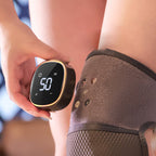 Self heating knee massager